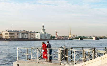 Saint-Petersburg, Russia â June 16, 2020: People look at the landmarks of the city from the small pier of The Neva Riverのeditorial素材