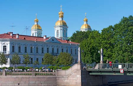 Saint-Petersburg, Russia - June 13, 2020: People rest near St. Nicholas Naval Cathedral. The Baroque Orthodox cathedral was built in 1753-1762のeditorial素材