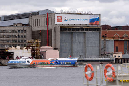 Saint-Petersburg, Russia - August 11, 2020: Hydrofoil tour boat sails past The Admiralty Shipyardのeditorial素材
