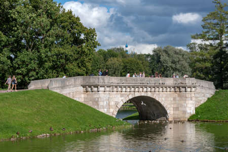 Gatchina, Leningrad Region, Russia - August 18, 2021: The Carp Bridge near The Carp Pond in The State Museum Preserve Gatchinaのeditorial素材