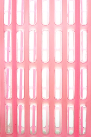 Pink color plastic basket on white backgroundの写真素材