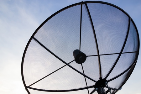 Black Satellite dish in evening skyの写真素材