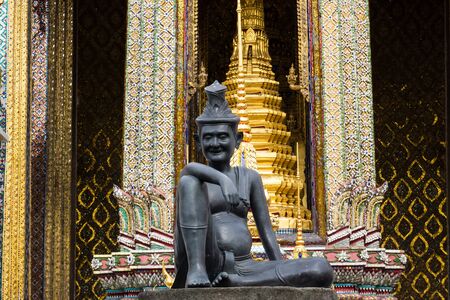 statue of hermit located in front of temple, wat phra keaw, Bangkok Thailandの写真素材