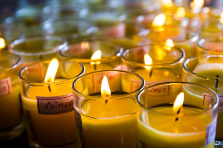 Candlelight in small glass at Leng Noei Yi 2 temple  Prabaromrachapisek Temple , Nonthaburi,...