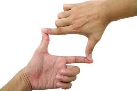 Man's hands making photo frame on white の写真素材