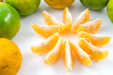 Orange fruit on white with shadowの写真素材