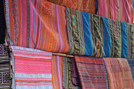 Colorful fabrics, traditional canvas for sale at vietnamese market in Bac Ha