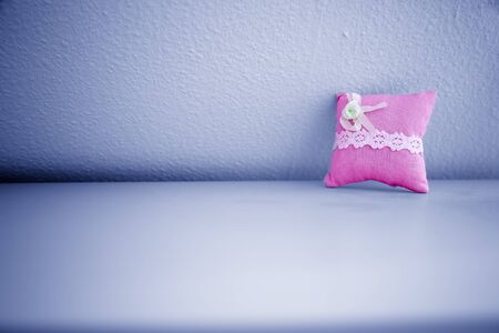Pink Pillow on Wallの写真素材