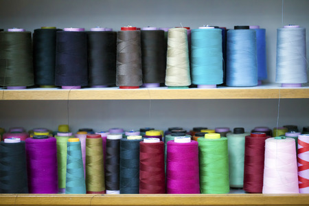 Fiber Cotton Fabric Textile Roller on bobbin and light ropes Yarnの写真素材
