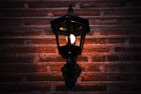 Night Lamp on a Brick Stone Wall Photo