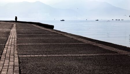 Couple Lovers Silhouette Near the Seaside Photoの写真素材