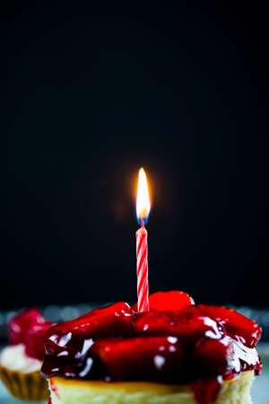Small Birthday Cake and the Candle Lightの写真素材