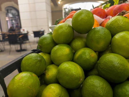 Organic Vegetable Lime Green Lemon in a Grocery Marketの写真素材