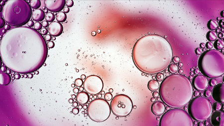 Abstract Colorful Food Oil Drops Bubbles and spheres Flowing on Water Surface, macro Photography