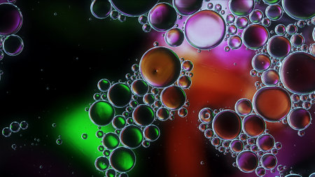 Abstract Colorful Food Oil Drops Bubbles and spheres Flowing on Water Surface, macro Photographyの写真素材