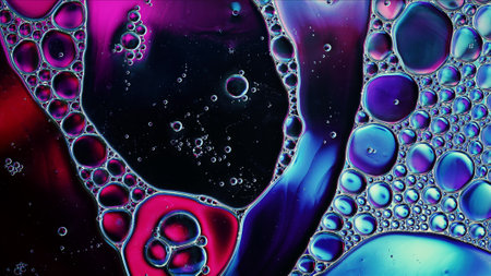 Abstract Colorful Food Oil Drops Bubbles and spheres Flowing on Water Surface, macro Photography