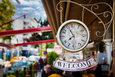 Welcome Sign Hanging on Wall Clock City Concept