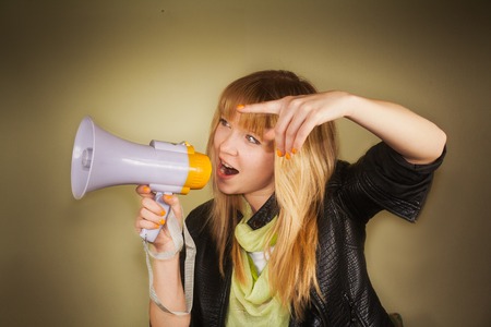 girl shouting with megaphoneの写真素材