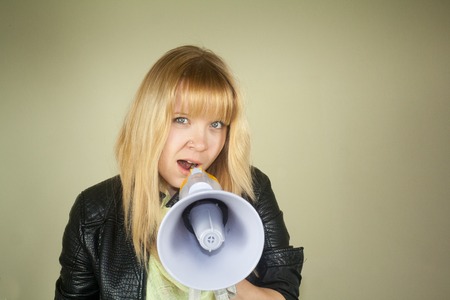 girl talking with megaphoneの写真素材