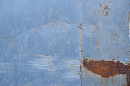 Rusty scratched grunge metal wall detailed texture backgroundの写真素材