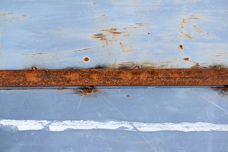 Rusty scratched grunge metal wall detailed texture backgroundの写真素材