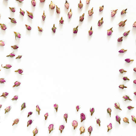 Floral pattern made of pink and beige roses on white background. Flat lay, top view. Flowers pattern textureの写真素材