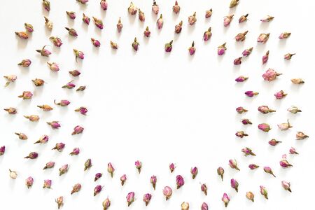 Floral pattern made of pink and beige roses on white background. Flat lay, top view. Flowers pattern textureの写真素材