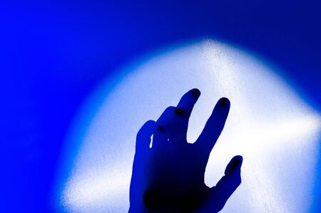 Hands in colorful blue red contrast neon light