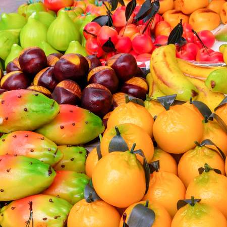 Rich assortment of fruit shaped sweets. They are typical and traditional Sicilian food, made with marzipanの写真素材