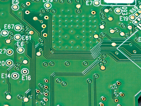 Closeup of green computer mother board, electronic elements and circuit