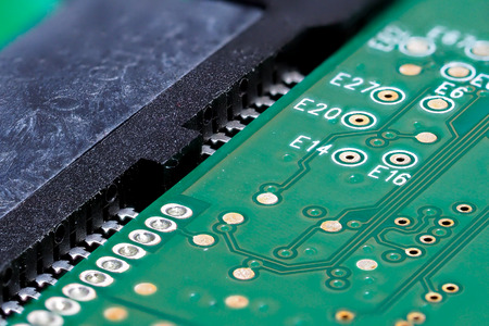 Closeup of green computer mother board, electronic elements and circuit