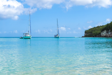 2 yachts moored in Marie Galante turquoise sea, Guadeloupe luxury tourismの写真素材