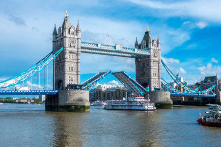 London, GB, may 5th 2016: London Tower Bridge path lifted to allow tourist ferry passing troughのeditorial素材