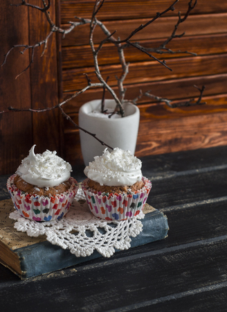 Delicious cupcakes on a wooden table. Tea time. Vintage and rustic styleの写真素材
