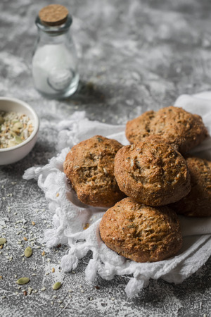Multi seeds whole wheat rolls on a grey stone background. Healthy foodの写真素材