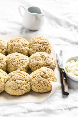 Orange oatmeal scones on a light backgroundの写真素材