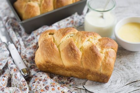 brioche on a light wooden backgroundの写真素材