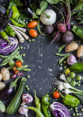 Food background. Assortment of fresh garden vegetables. Top view, free space for textの写真素材