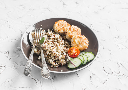 Quinoa, chicken meatballs and fresh vegetables on a light background. Healthy delicious foodの写真素材
