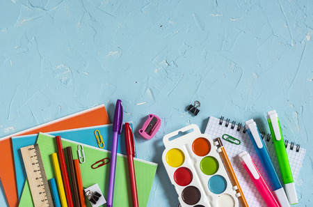 School supplies and accessories on a blue background. Free space for text. Top view. Education backgroundの写真素材