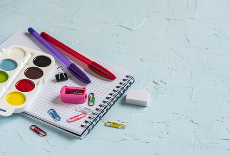 School supplies on blue background. Free space for textの写真素材