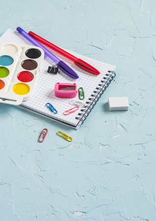 School supplies on blue background. Free space for textの写真素材