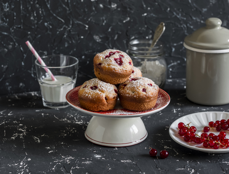 Delicious summer dessert - red currant muffins  on a dark background.  Rustic and vintage styleの写真素材