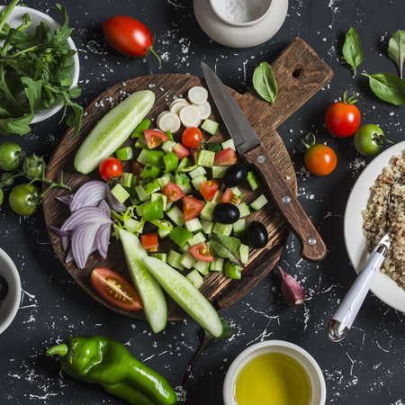 Ingredients for salad - quinoa and vegetables  on a dark background. Delicious vegetarian foodの写真素材
