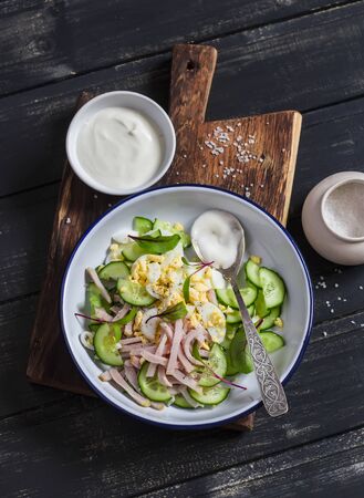 Easy and fast salad with smoked turkey, cucumber and boiled egg. Healthy foodの写真素材