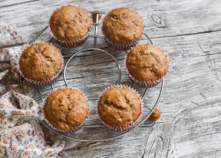 Oatmeal and banana vegan muffins on rustic light wooden board. Healthy foodの写真素材