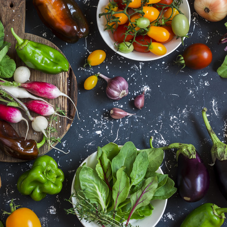 Assortment of fresh vegetables - tomatoes, radishes, eggplant, beets, peppers, garlic, onion,...