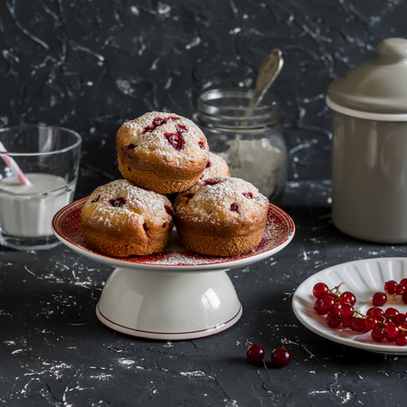 Delicious summer dessert - red currant muffins  on a dark background.  Rustic and vintage styleの写真素材