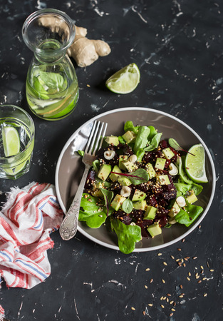 Beet and avocado detox salad. On a dark background. Healthy vegetarian foodの写真素材