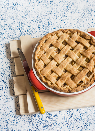 Rustic apple tart on a light background. Top viewの写真素材